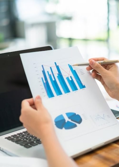 business-people-using-laptop-financial-charts-meeting-office_1232-4455