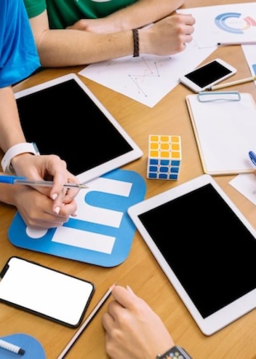 close-up-businesspeople-with-digital-tablet-social-media-icons-table_23-2147847546