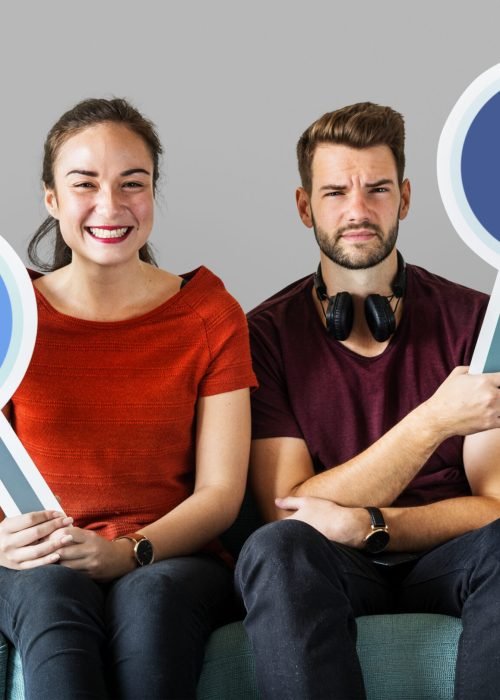 Couple holding social media icons