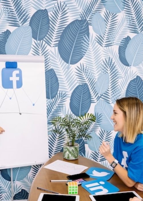 happy-colleagues-looking-facebook-chart_23-2147847457