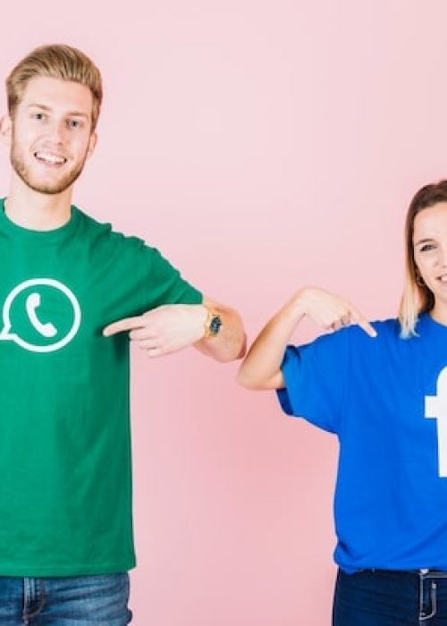 happy-couple-pointing-their-t-shirt-with-facebook-whatsapp-icon_23-2147849445