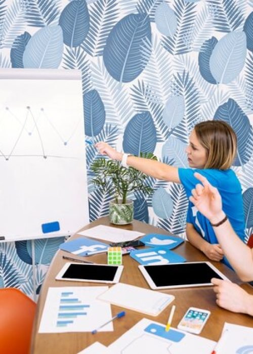 social-media-team-discussing-graph-workplace_23-2147847456