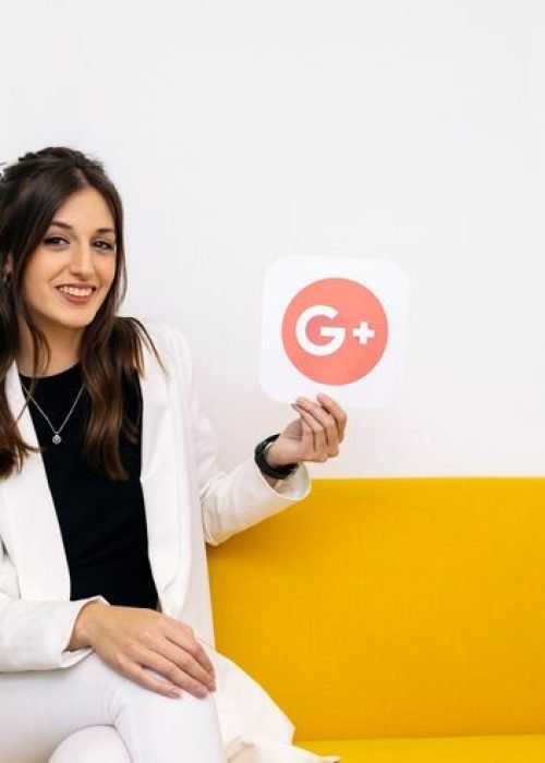 young-stylish-businesswoman-showing-google-plus-icon-her-hand_23-2147847513